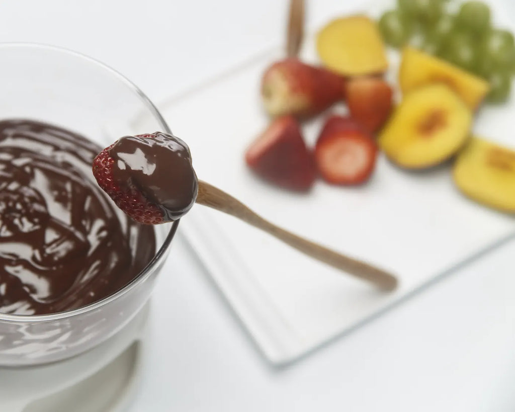 Chocolate fondue served with fresh fruit